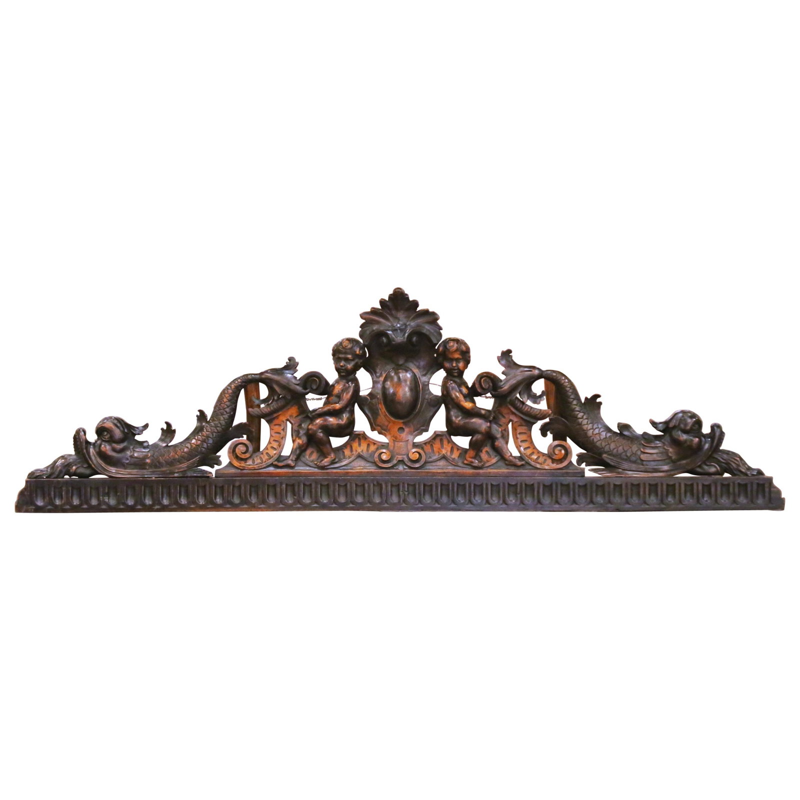 Louis XVI Era Walnut Pediment with Hand-Carved Putti and Acanthus Motifs: Louis XVI Era Walnut Pediment with Hand-Carved Putti and Acanthus Motifs This early 19th century French walnut pediment features exquisite hand-carved detailing in the transitional Louis XVI to early 