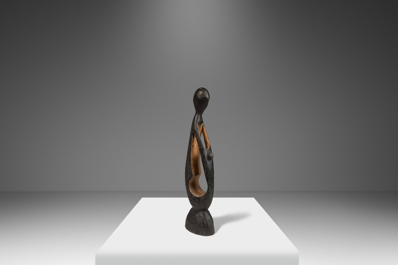 Vintage Post Modern Hand-Carved Walnut Mother & Child Sculpture 1970s: Vintage Post Modern Hand-Carved Walnut Mother & Child Sculpture 1970s Discover a stunning Post Modern Abstract Hand-Carved Sculpture representing the tender embrace of a mother and child. This heartwa