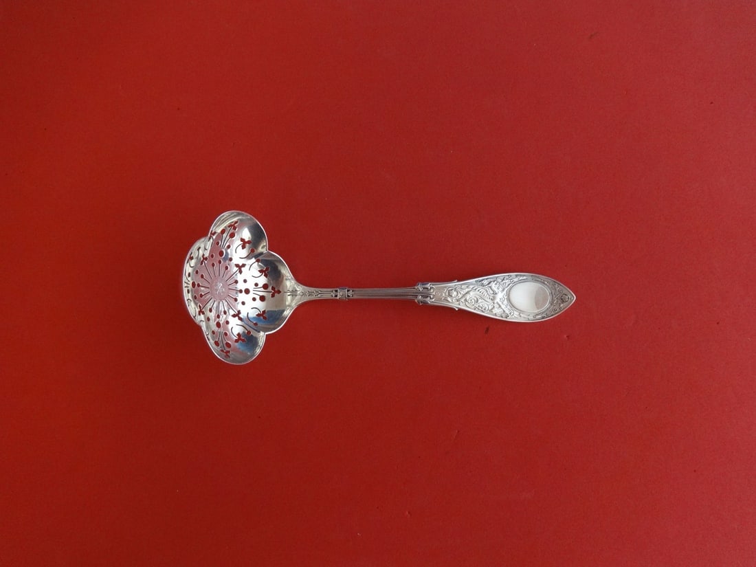 Whiting Arabesque Sterling Silver Sugar Sifter Ladle 6 1/4 inches Clovers Design: Whiting Arabesque Sterling Silver Sugar Sifter Ladle 6 1/4 inches Clovers Design This exquisite sterling silver sugar sifter ladle is crafted by Whiting in the elegant Arabesque pattern. Featuring a d