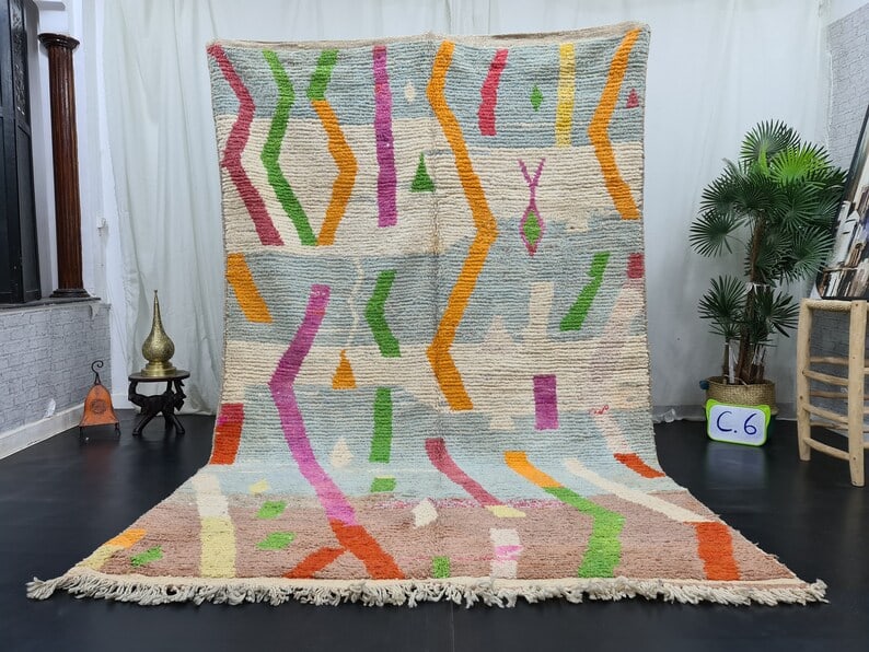 Handwoven Moroccan Rug 100% Local Sheep Wool 8x5 Feet: Handwoven Moroccan Rug 100% Local Sheep Wool 8x5 Feet Discover the beauty of this Elegant Authentic Rug, handwoven in the Atlas Mountains by skilled local Berber women. Crafted using traditional tools