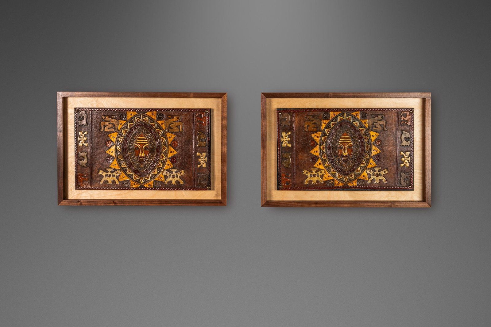 Angel Pazmino Set of 2 Framed Embossed Leather Incan Artworks Ecuador 1960s: Angel Pazmino Set of 2 Framed Embossed Leather Incan Artworks Ecuador 1960s This exquisite set of two Mid-Century Modern framed embossed leather artworks is crafted by renowned Ecuadorian artisan Ange
