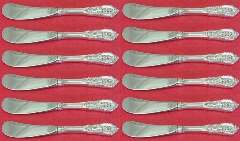 Set of 12 Wallace Rose Point Sterling Silver 6 Butter Spreaders: Set of 12 Wallace Rose Point Sterling Silver 6 Butter Spreaders Enhance your dining experience with this exquisite set of 12 Rose Point butter spreaders by Wallace. Each spreader features a hollow han