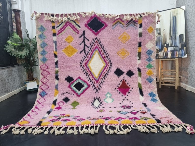 Authentic Pink Handmade Berber Moroccan Wool Rug 9.84 x 6.56 Feet: Authentic Pink Handmade Berber Moroccan Wool Rug 9.84 x 6.56 Feet Experience the warmth and elegance of this authentic pink handmade Berber Moroccan rug, crafted by skilled local Berber women weavers 