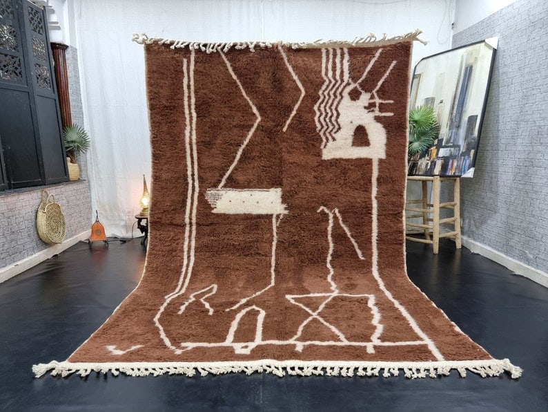 Authentic Handwoven Moroccan Berber Brown Wool Rug 9.84 x 6.56 Feet: Authentic Handwoven Moroccan Berber Brown Wool Rug 9.84 x 6.56 Feet Enhance your living space with this stunning handmade Moroccan Berber wool carpet, featuring a beautiful brown base complemented by 