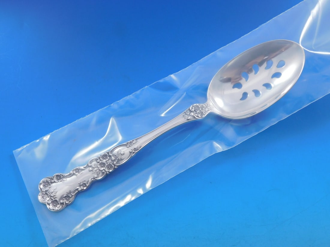 Gorham Buttercup Sterling Silver 9-Hole Slotted Serving Spoon 8 3/8": Gorham Buttercup Sterling Silver 9-Hole Slotted Serving Spoon 8 3/8" Enhance your dining experience with this exquisite Buttercup by Gorham Sterling Silver Serving Spoon. Crafted with precision, this 
