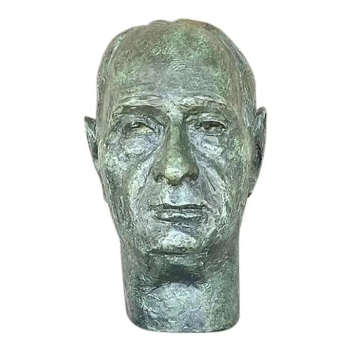 Vintage Patinated Bronze Bust of Man on Stone Plinth: Vintage Patinated Bronze Bust of Man on Stone Plinth This vintage portrait bust of a man is a striking piece of sculpture that embodies character and history. Crafted with a richly textured surface an