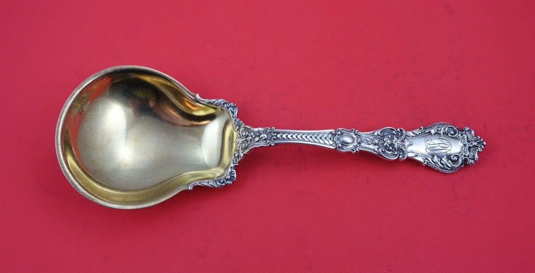 Gorham Henry II Sterling Silver Berry Spoon Gold Washed 9 1/4": Gorham Henry II Sterling Silver Berry Spoon Gold Washed 9 1/4" This exquisite serving spoon is crafted from sterling silver in the classic Henry II pattern by Gorham. The spoon features a wide bowl an