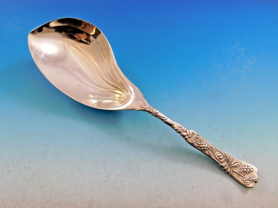 Tiffany & Co. Vine Sterling Silver Pudding Spoon with Raspberry Motif: Tiffany & Co. Vine Sterling Silver Pudding Spoon with Raspberry Motif This stunning serving spoon from the Vine pattern by Tiffany & Co. is crafted from high-quality sterling silver. Measuring 9 1/2 i