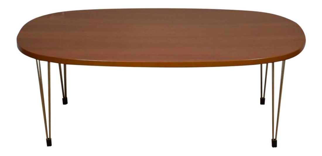Mid-Century Danish Cherry Oval Coffee Table with Chrome Legs 47.25": Mid-Century Danish Cherry Oval Coffee Table with Chrome Legs 47.25" This elegant mid-century modern Danish oval coffee table features a stunning cherry wood top complemented by a unique base of four c