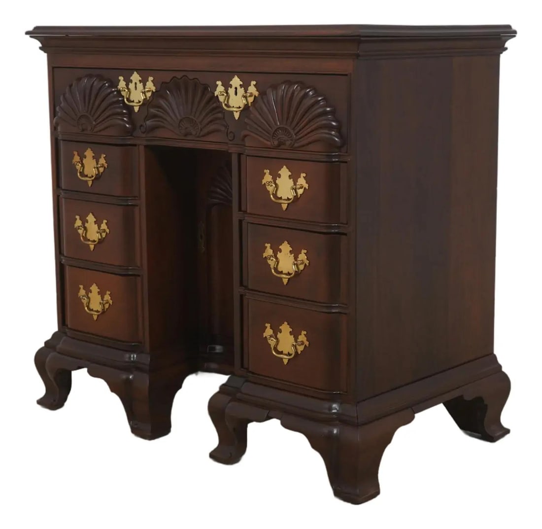 Mahogany Yale block front kneehole desk chest: Mahogany Yale block front kneehole desk chest This kneehole desk chest is crafted in the Chippendale style and inspired by the Goddard Townsend tradition, featuring mahogany wood construction with fin