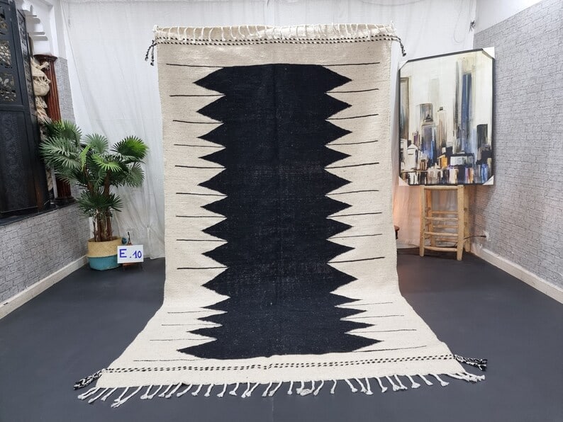 Authentic Black & White Moroccan Rug 10 x 5 Feet Handwoven Wool: Authentic Black & White Moroccan Rug 10 x 5 Feet Handwoven Wool This authentic Black & White Rug is handwoven in the Atlas Mountains by skilled Berber women weavers. Crafted using traditional tools an