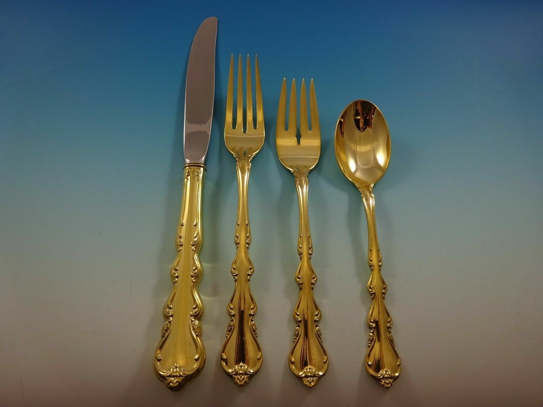 International Angelique Vermeil Sterling Silver 4-Piece Place Setting: International Angelique Vermeil Sterling Silver 4-Piece Place Setting This exquisite Angelique Vermeil place setting by International Sterling features a beautiful gold-washed finish, making it a stun