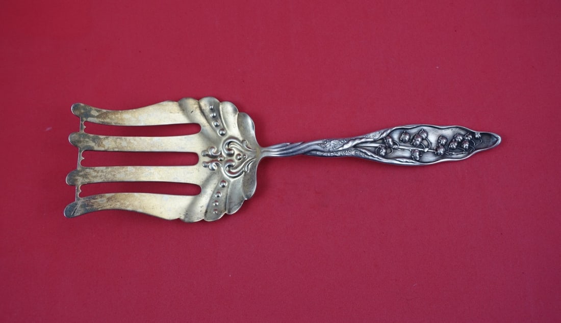 Sterling Silver Asparagus Fork Gold Wash Bar Whiting Lily of the Valley 9 1/4": Sterling Silver Asparagus Fork Gold Wash Bar Whiting Lily of the Valley 9 1/4" This is a Whiting sterling silver asparagus fork in the Lily of the Valley pattern, featuring a gold wash finish with a b