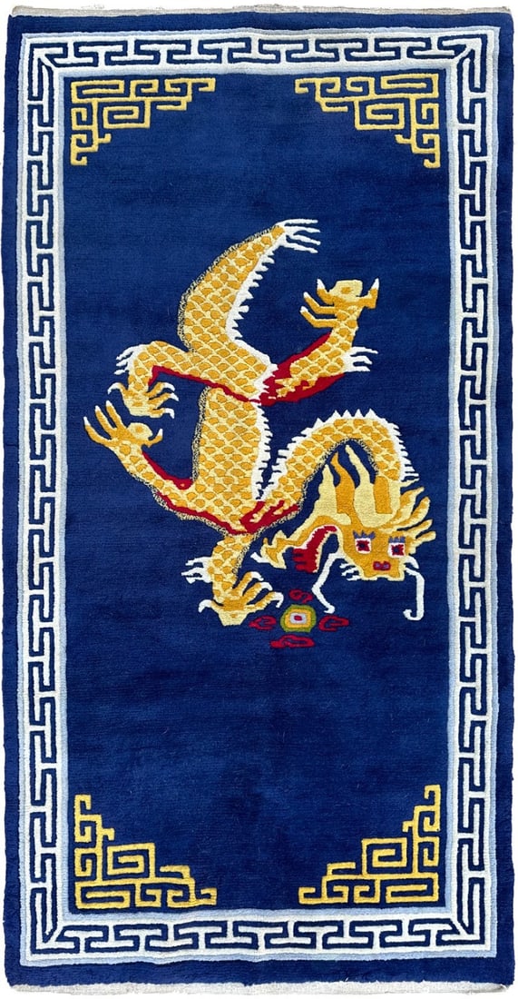 Blue Wool Tibetan Dragon Tapestry Rug 3 x 6 ft: Blue Wool Tibetan Dragon Tapestry Rug 3 x 6 ft This vintage Tibetan rug features a bold golden dragon motif set against a rich cobalt blue field, complemented by traditional Asian geometric border det