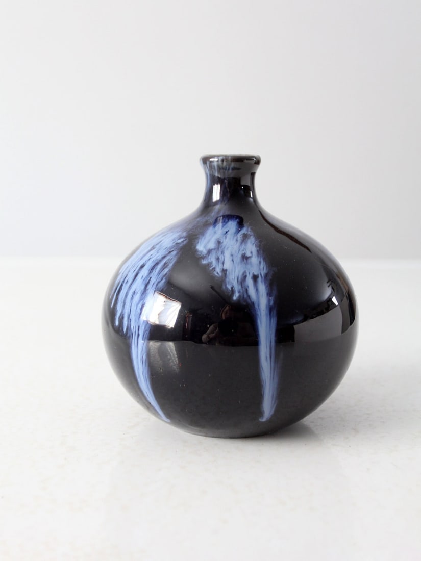 Vintage Huronia Pottery Vase Black Blue Flame Glaze 5.5 Inch: Vintage Huronia Pottery Vase Black Blue Flame Glaze 5.5 Inch This vintage Huronia Pottery vase, crafted in Canada during the late 1960s, features a distinctive bottle neck design highlighted by a stri