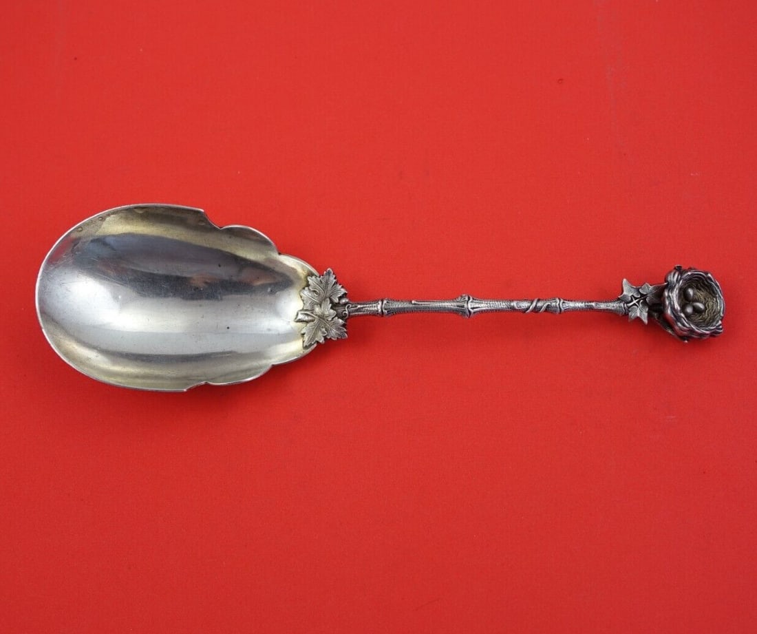 Gorham Birds Nest sterling berry spoon 9 1 4 inch figural handle: Gorham Birds Nest sterling berry spoon 9 1 4 inch figural handle This is a Gorham sterling silver berry serving spoon in the Birds Nest pattern, dating from 1850-1899. The spoon features a detailed th