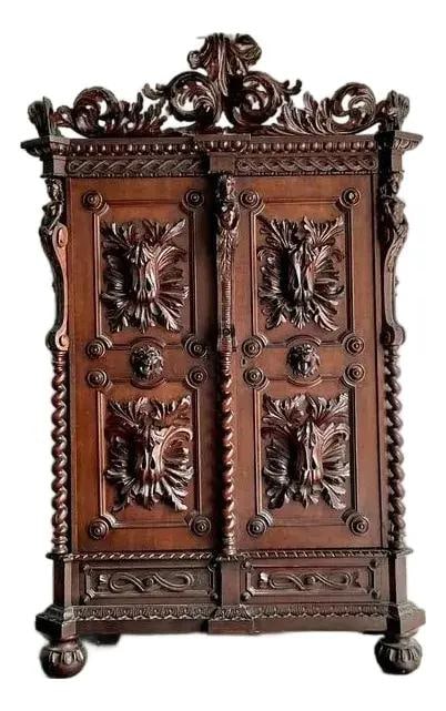 Renaissance Revival Oak Wardrobe With Barley Twist Columns and Carved Detailing: Renaissance Revival Oak Wardrobe With Barley Twist Columns and Carved Detailing This vintage Black Forest style armoire is masterfully crafted from solid oak with a deep, rich finish. Featuring elabor