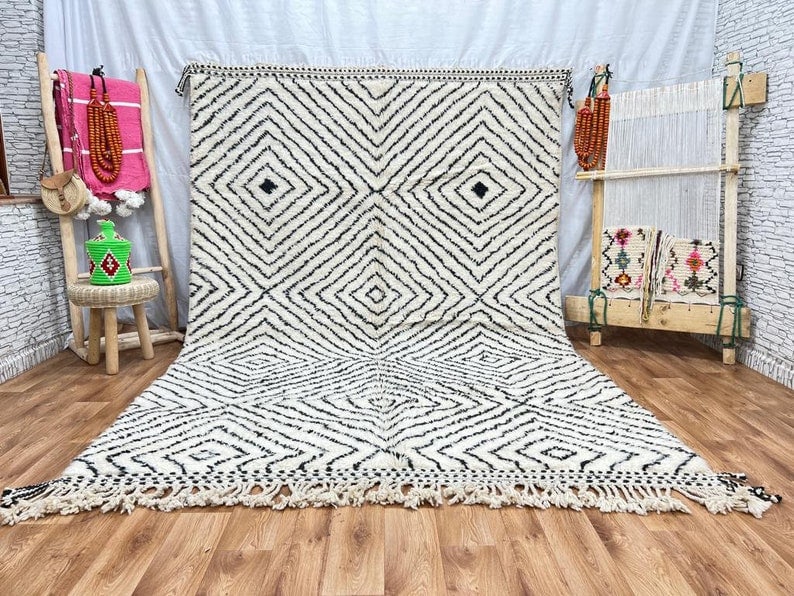 Handwoven Moroccan Soft Rug 100% Sheep Wool 8 x 5 Feet: Handwoven Moroccan Soft Rug 100% Sheep Wool 8 x 5 Feet Discover the beauty of this authentic, handwoven rug, crafted by skilled Berber women weavers in the Atlas Mountains of Morocco. Made from 100% l