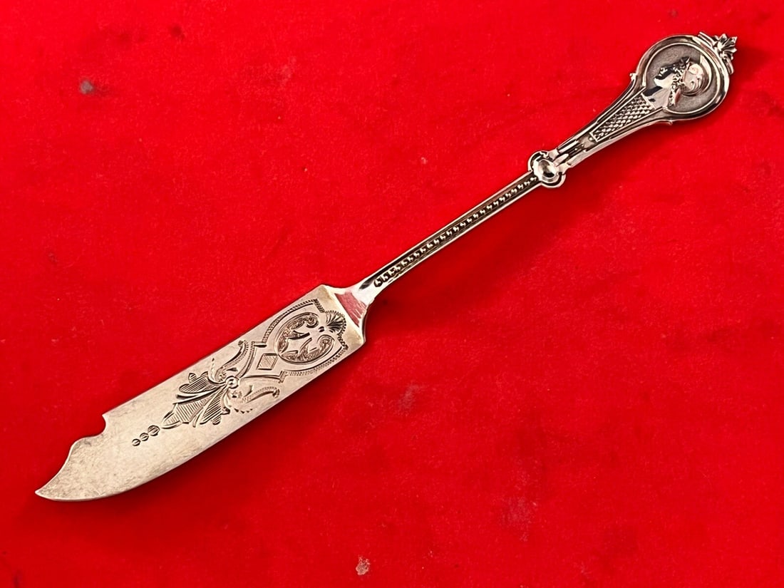 Victorian Coin Silver Pickle Knife Medallion Warrior by Wood & Hughes 6 3/8 in: Victorian Coin Silver Pickle Knife Medallion Warrior by Wood & Hughes 6 3/8 in This exquisite pickle knife from Wood & Hughes, known as Medallion or Warrior, showcases the elegance of Victorian design