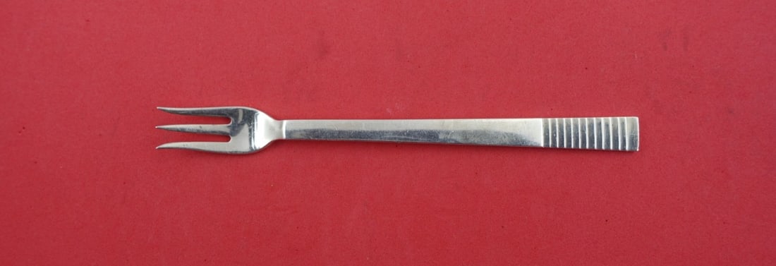 Georg Jensen Parallel Sterling Silver Cocktail Fork 5 5/8": Georg Jensen Parallel Sterling Silver Cocktail Fork 5 5/8" Discover the elegance of the Parallel cocktail fork by Georg Jensen, crafted from high-quality sterling silver. This exquisite piece, measuri