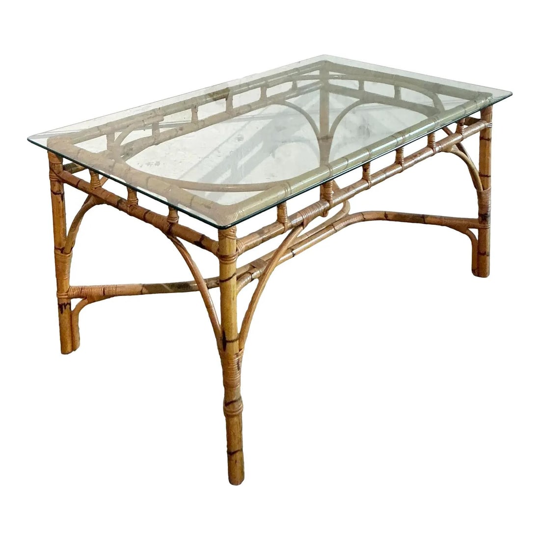Vintage Bamboo Dining Table with Glass Top and Rattan Details: Vintage Bamboo Dining Table with Glass Top and Rattan Details Enhance your home with this Vintage Coastal Wrapped Bamboo Dining Table, exuding organic warmth and vintage charm. The robust bamboo frame