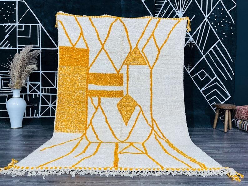 Authentic Handwoven Soft Wool Rug from Morocco 9.84 x 6.56 Feet: Authentic Handwoven Soft Wool Rug from Morocco 9.84 x 6.56 Feet Experience the beauty and craftsmanship of this Stunning Soft Wool Rug, handwoven in the Atlas Mountains by skilled Berber women weavers