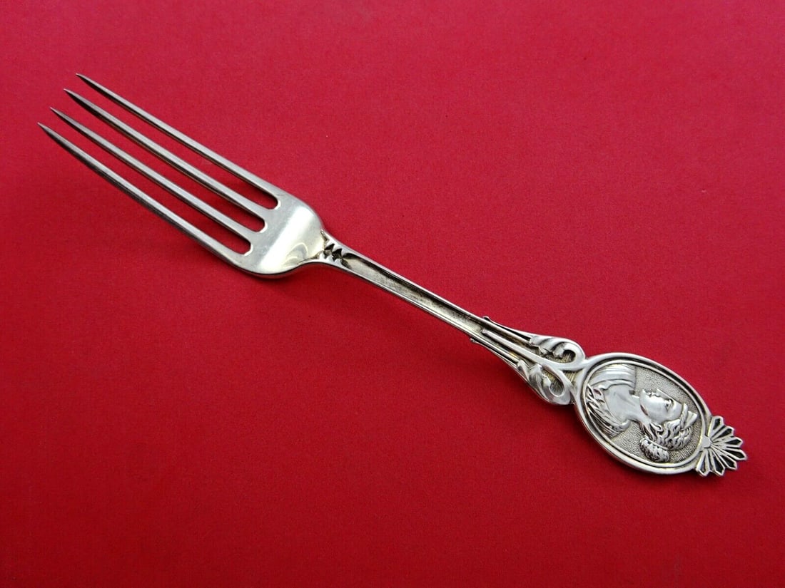 Wood & Hughes Medallion Diana Coin Silver Fork 7 Inch Unmonogrammed: Wood & Hughes Medallion Diana Coin Silver Fork 7 Inch Unmonogrammed This exquisite 7" fork is part of the Medallion pattern, also known as Diana, crafted by Wood and Hughes. Made from coin silver, thi