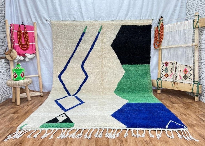 Authentic Handwoven Soft Rug 100% Sheep Wool from Morocco 10 x 6.56 ft: Authentic Handwoven Soft Rug 100% Sheep Wool from Morocco 10 x 6.56 ft Transform your space with this stunning authentic soft rug, handwoven in the Atlas Mountains by skilled Berber women weavers. Cra
