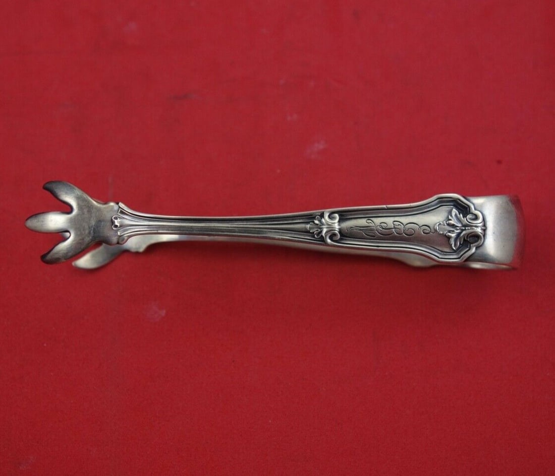 Wallace Corinthian Sterling Silver Sugar Tong 4 Inch Serving Piece: Wallace Corinthian Sterling Silver Sugar Tong 4 Inch Serving Piece Enhance your serving collection with this exquisite Corinthian by Wallace Sterling Silver Sugar Tong. Measuring 4 inches, this elegan
