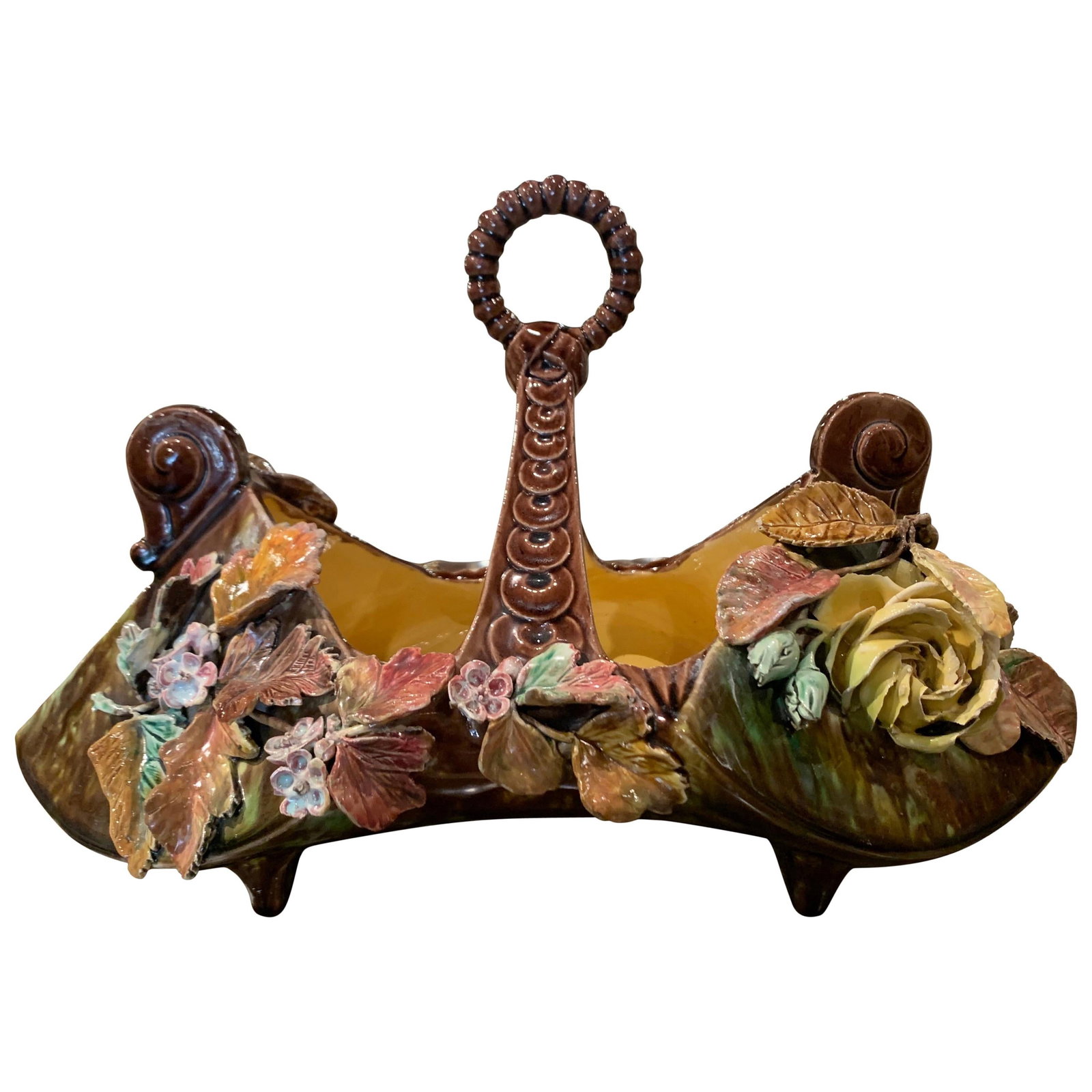 French Majolica Jardiniere with Snail Motifs and Floral Relief: French Majolica Jardiniere with Snail Motifs and Floral Relief This mid-century French barbotine majolica jardiniere, crafted circa 1950, features a sculptural double-compartment design joined by a ce