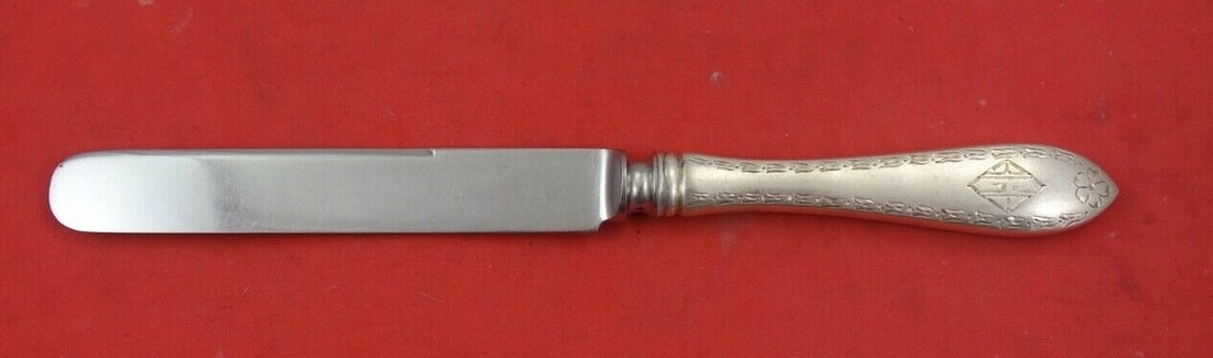 Schofield Scroll Engraved Edge Sterling Silver Dessert Knife 7 1/4": Schofield Scroll Engraved Edge Sterling Silver Dessert Knife 7 1/4" This exquisite dessert knife features a stunning scroll engraved edge design by Schofield, crafted from high-quality sterling silver