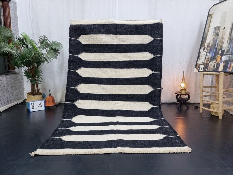Elegant Handmade Moroccan Berber Wool Rug 8 x 5 Feet: Elegant Handmade Moroccan Berber Wool Rug 8 x 5 Feet Enhance your space with this Elegant Handmade Moroccan Berber Wool Rug. Skillfully handwoven in the Middle Atlas Mountains by local Berber women we