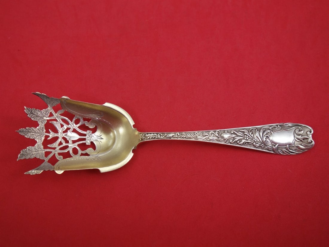 Knowles Aeolian Sterling Silver Nut Scoop Gold Washed Bright Cut 7 1/4: Knowles Aeolian Sterling Silver Nut Scoop Gold Washed Bright Cut 7 1/4 Sterling silver nut scoop in the Aeolian pattern by Knowles, featuring a gold-washed, bright-cut, and pierced leaf design. It mea
