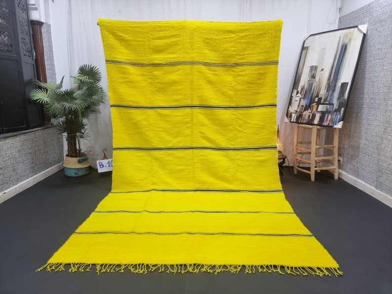 Authentic Handmade Yellow Moroccan Berber Wool Rug 10 x 5 Feet: Authentic Handmade Yellow Moroccan Berber Wool Rug 10 x 5 Feet Discover the elegance of this Authentic Yellow Handmade Moroccan Berber Wool Rug. Handwoven in the Atlas Mountains by skilled Berber wome