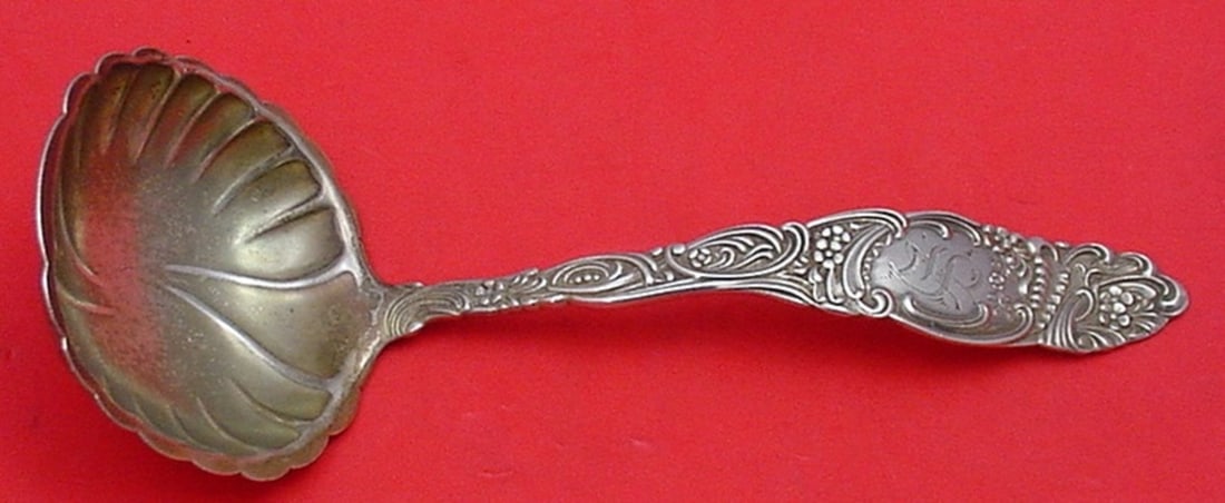 Towle Princess Sterling Silver Goldwashed Gravy Ladle 6 1/2: Towle Princess Sterling Silver Goldwashed Gravy Ladle 6 1/2 A Princess pattern gravy ladle by Towle, made of sterling silver with a goldwashed finish. It is monogrammed, with monograms varying, and is