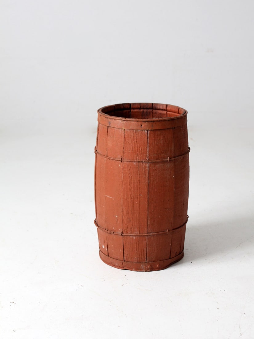 Antique Rustic Red Painted Barrel 17 inch Height: Antique Rustic Red Painted Barrel 17 inch Height Discover this charming antique primitive painted barrel, featuring a rustic red finish complemented by sturdy wood slats and metal banding. This decora