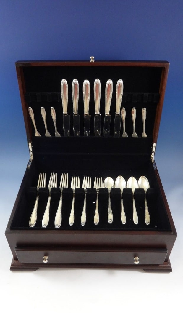 Leonore Sterling Silver Flatware Set 30 Pieces by Manchester with Storage Chest: Leonore Sterling Silver Flatware Set 30 Pieces by Manchester with Storage Chest Introducing the Leonore Sterling Silver Flatware Service Set, a delightful collection that brings elegance to your dinin