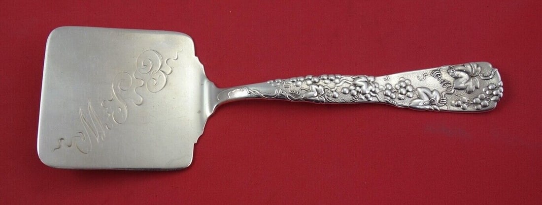 Tiffany & Co. Vine Sterling Silver Waffle Server 9 Inch Grapes: Tiffany & Co. Vine Sterling Silver Waffle Server 9 Inch Grapes Discover the elegance of the Vine pattern by Tiffany & Co. with this exquisite sterling silver waffle server. Measuring 9 inches, this se