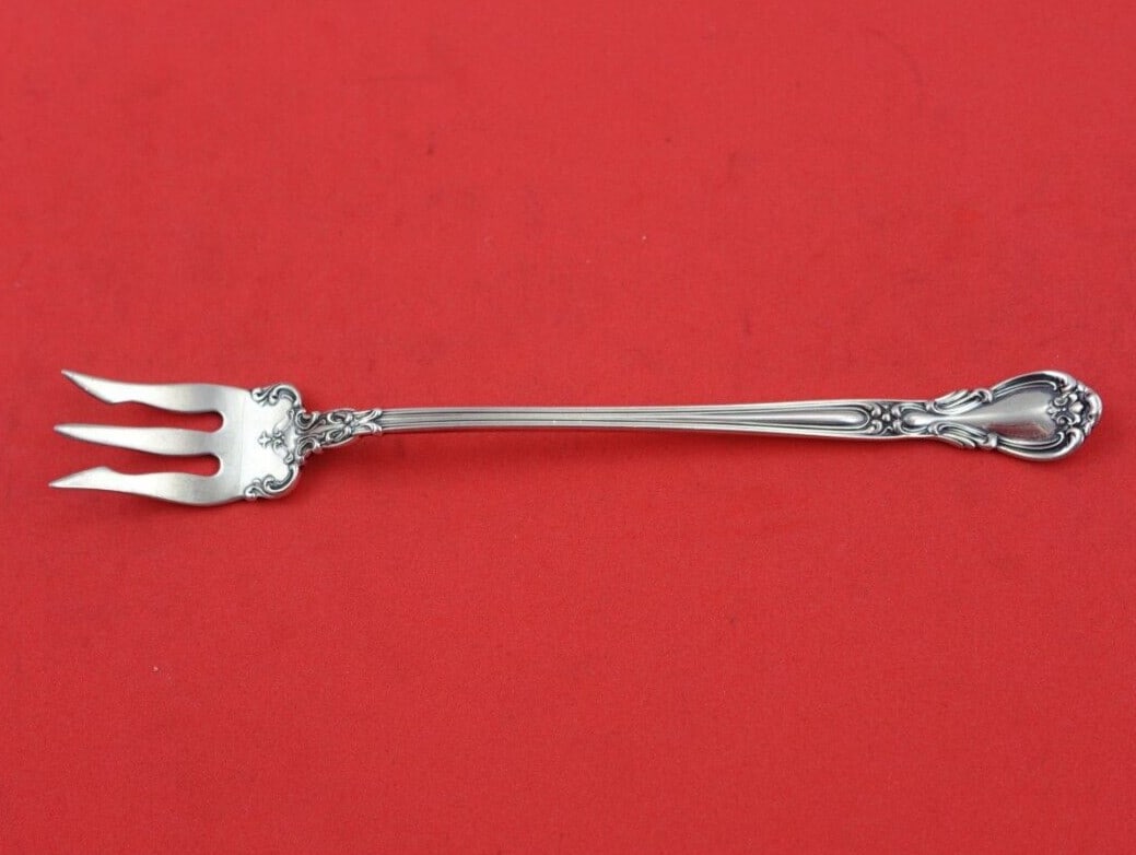 Gorham Chantilly Sterling Silver 3-Tine Oyster Fork with Lacing 5.5": Gorham Chantilly Sterling Silver 3-Tine Oyster Fork with Lacing 5.5" Add elegance to your dining experience with this Chantilly by Gorham Sterling Silver Oyster Fork. This 3-tine serving fork features