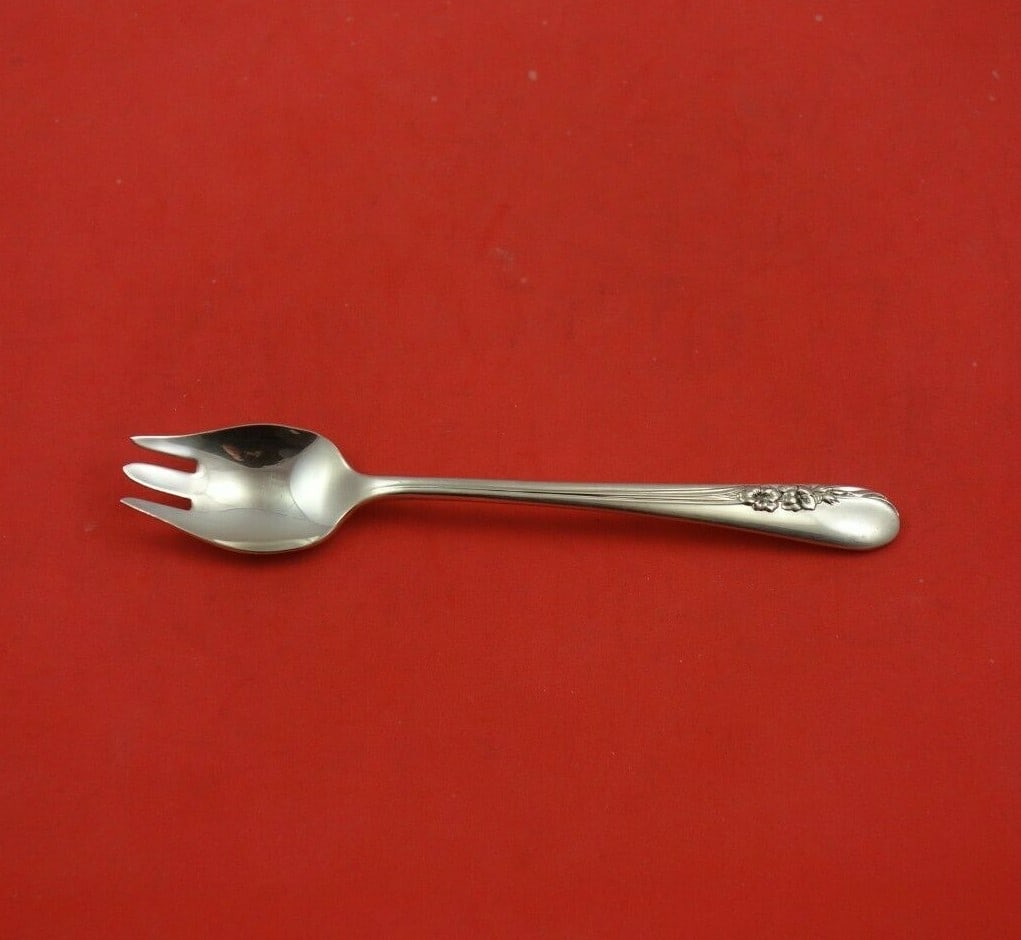 International Sterling Silver Blossom Time Ice Cream Fork 5 5/8": International Sterling Silver Blossom Time Ice Cream Fork 5 5/8" This exquisite ice cream fork is part of the Blossom Time pattern by International Sterling. Crafted from high-quality sterling silver,