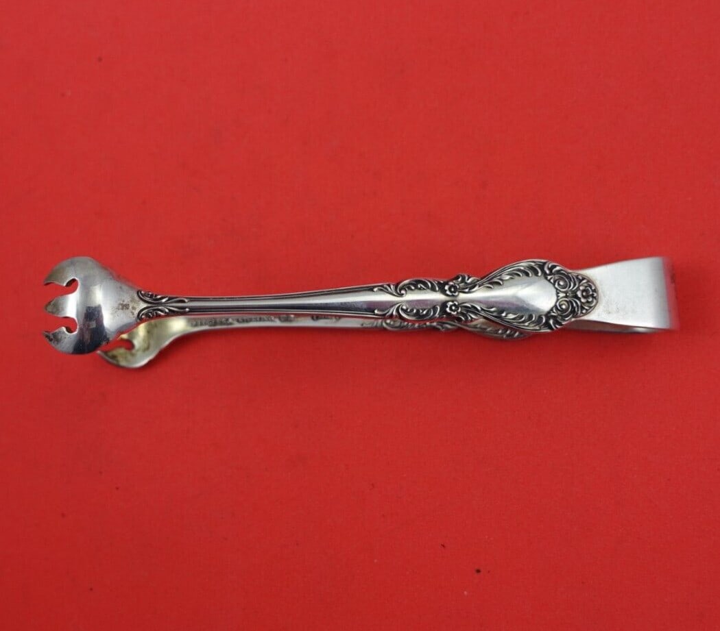 International Sterling Silver Sugar Tong Old Charleston 4" Serving Piece: International Sterling Silver Sugar Tong Old Charleston 4" Serving Piece Discover the elegance of the Old Charleston sugar tong by International, crafted from high-quality sterling silver (.925). This