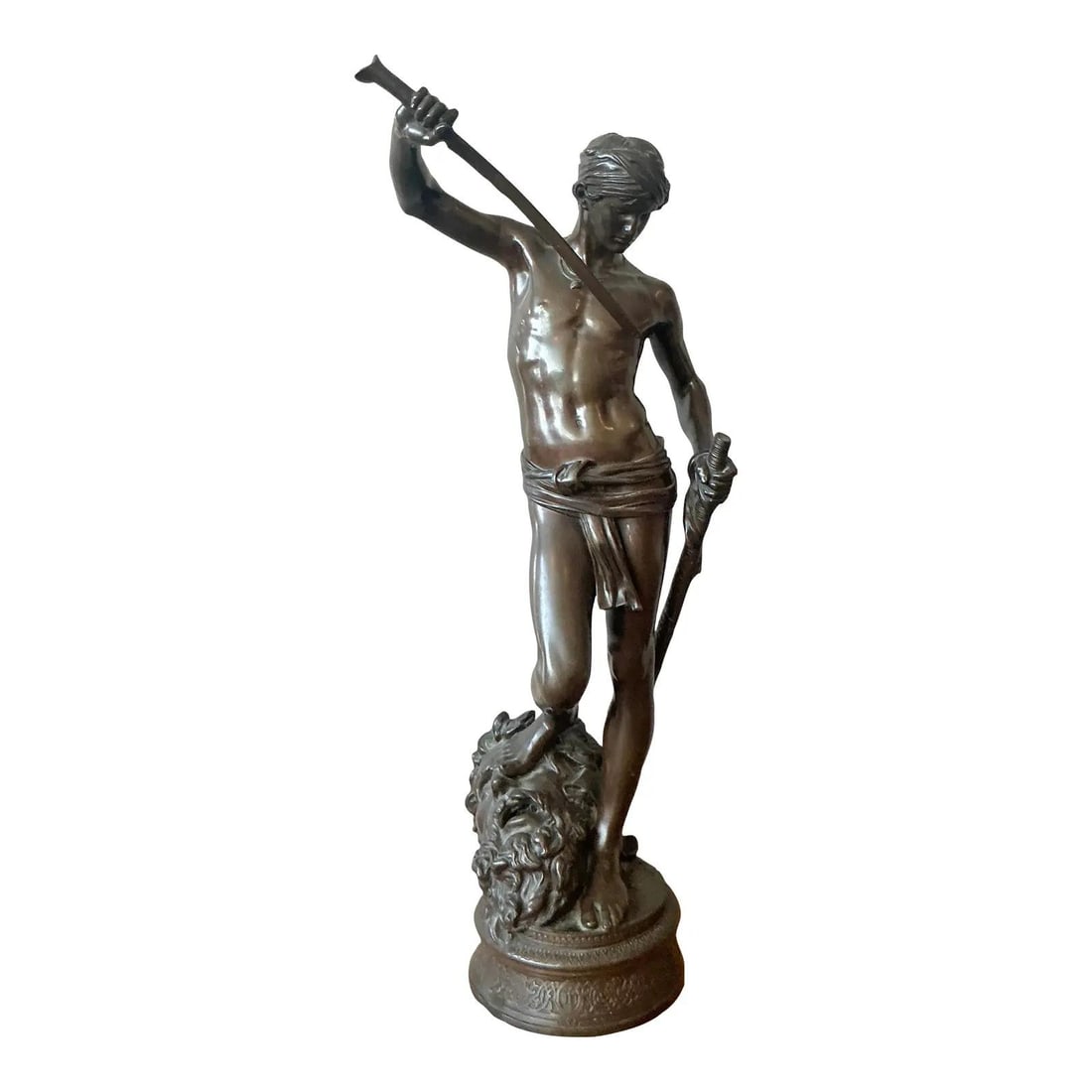 Cast Bronze Sculpture Depicting David Overcoming Goliath in Antonin Mercie Style: Cast Bronze Sculpture Depicting David Overcoming Goliath in Antonin Mercie Style This vintage cast bronze sculpture, inspired by the work of French artist Antonin Mercie, depicts the biblical scene of