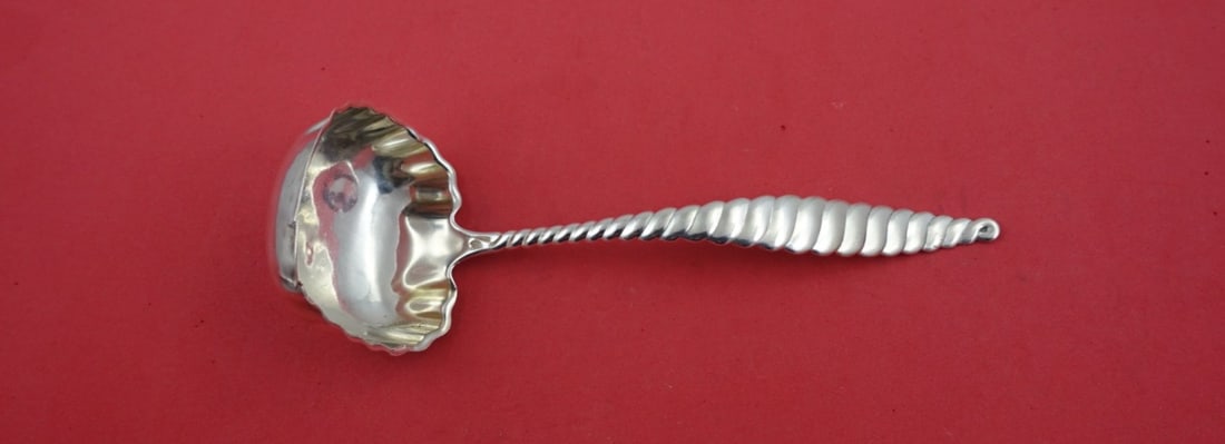 Whiting Oval Twist Sterling Silver Gravy Ladle 7 3/4": Whiting Oval Twist Sterling Silver Gravy Ladle 7 3/4" This exquisite Oval Twist gravy ladle by Whiting is a stunning example of craftsmanship from the 19th century. Made from high-quality sterling sil