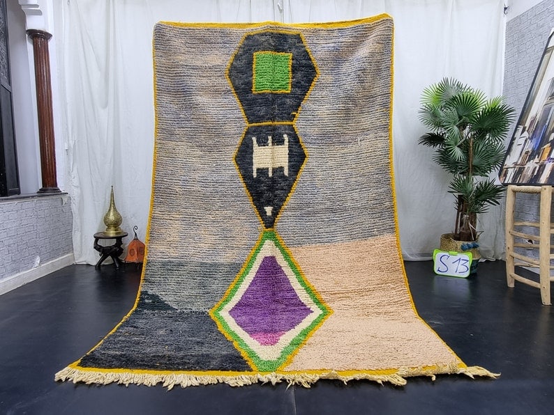 Authentic Handmade Moroccan Berber Wool Area Rug 8 x 5 Feet: Authentic Handmade Moroccan Berber Wool Area Rug 8 x 5 Feet Experience the warmth and craftsmanship of this authentic Artistic Handmade Moroccan Berber Wool Area Rug. Handwoven in the Atlas Mountains 
