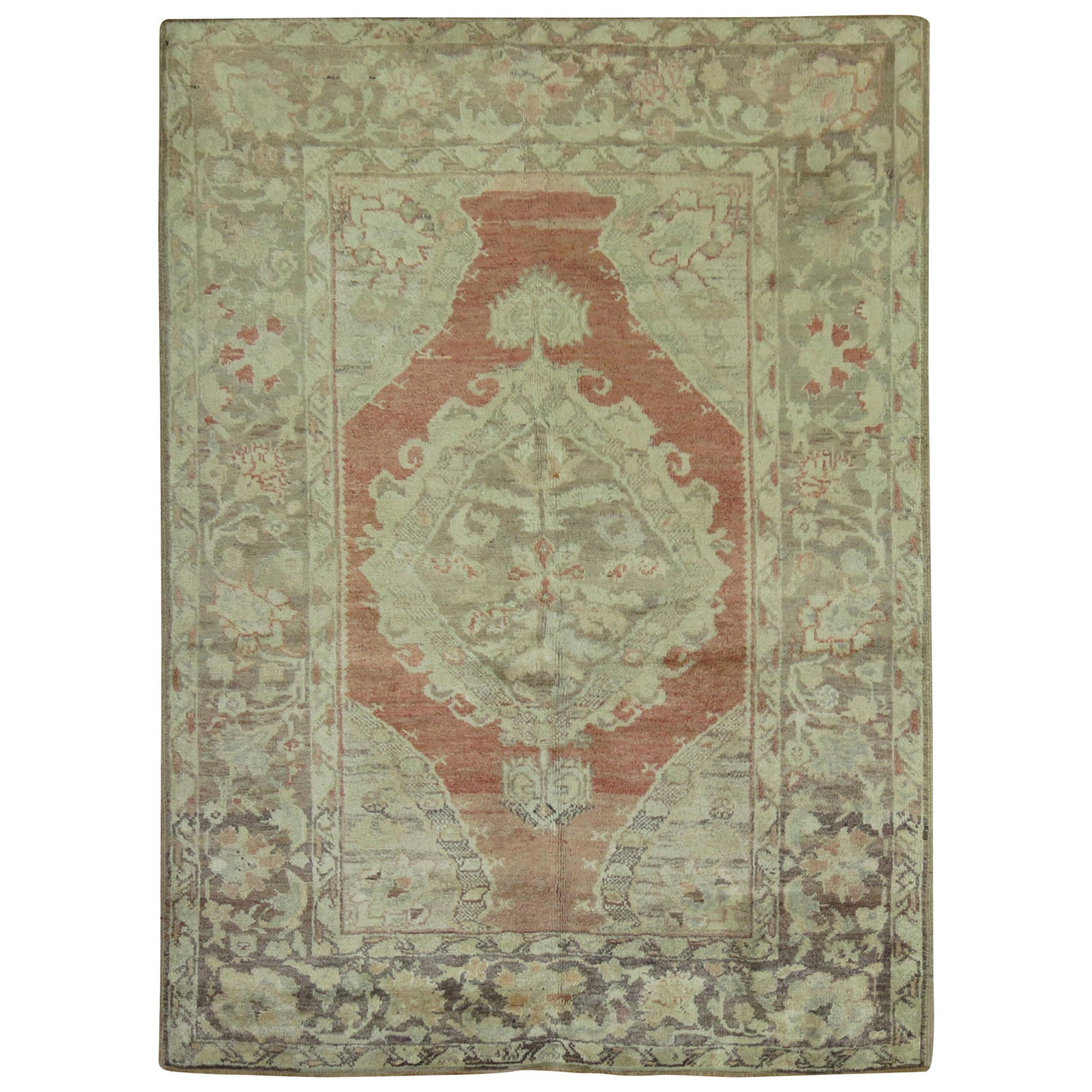 Tribal Turkish Oushak Wool Hand Knotted Rug 46 x 62 in: Tribal Turkish Oushak Wool Hand Knotted Rug 46 x 62 in This antique Turkish Oushak scatter rug from the early 20th century features a traditional tribal design and is hand-knotted from wool. Its compa