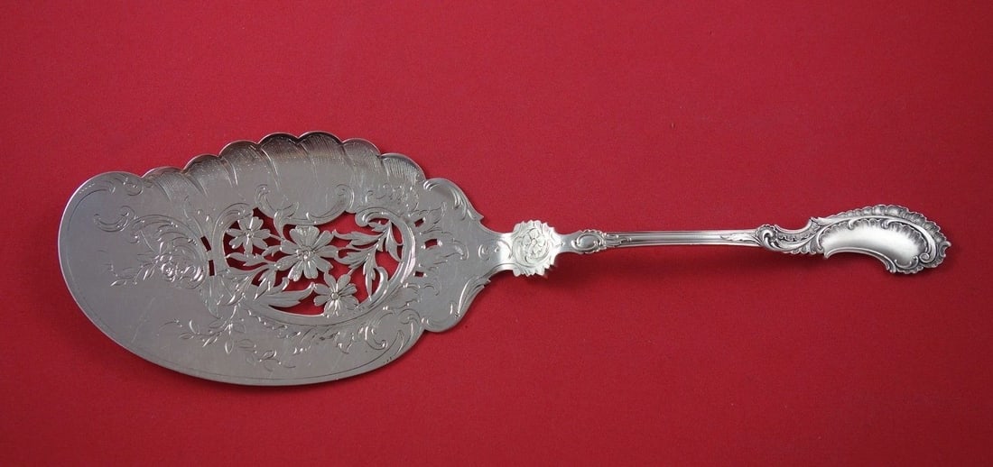 Antique 1886 Dutch Sterling Silver Fish Server with Pierced Daisies 11 7/8": Antique 1886 Dutch Sterling Silver Fish Server with Pierced Daisies 11 7/8" This exquisite fish server, crafted from sterling silver, showcases a beautiful pierced design with bright-cut details and e