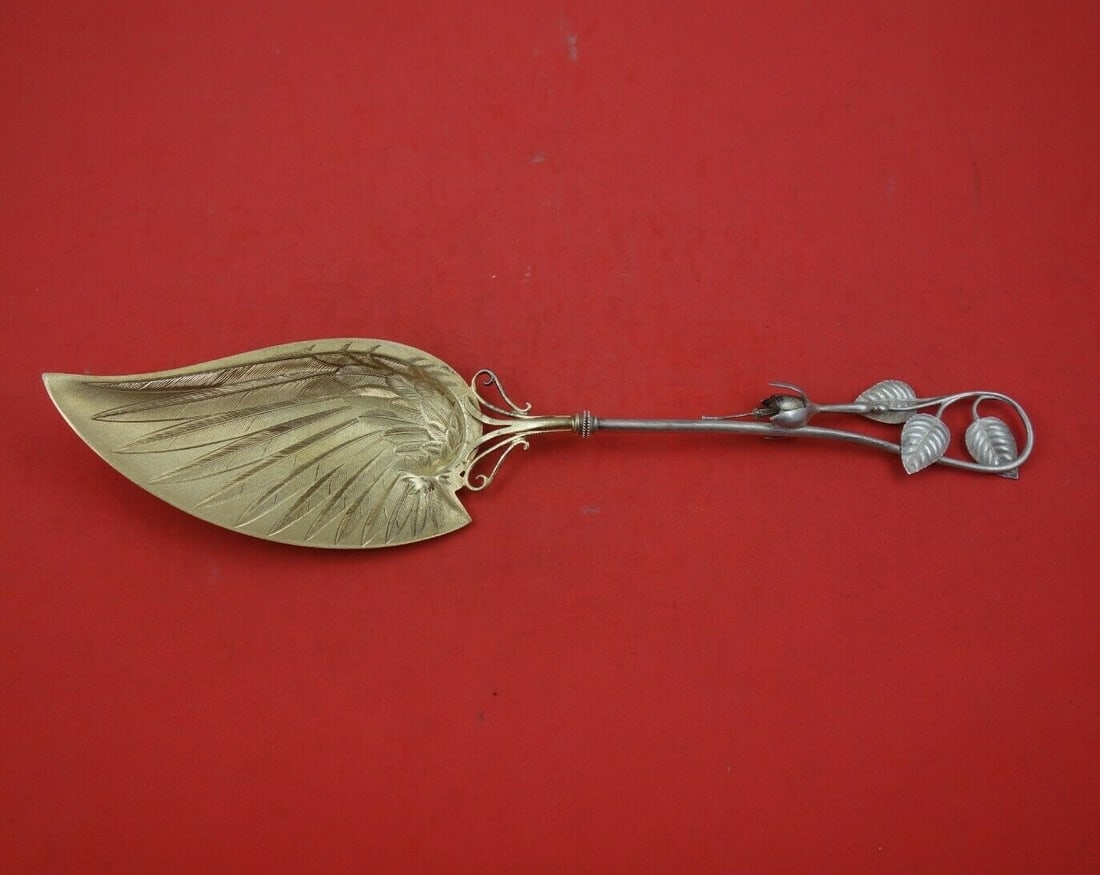 Whiting Fuchsia Sterling Silver Fish Server 11.5 Inch Bird Wing Design: Whiting Fuchsia Sterling Silver Fish Server 11.5 Inch Bird Wing Design Elevate your dining experience with this exquisite fish server from the Fuchsia pattern by Whiting. Crafted from sterling silver,
