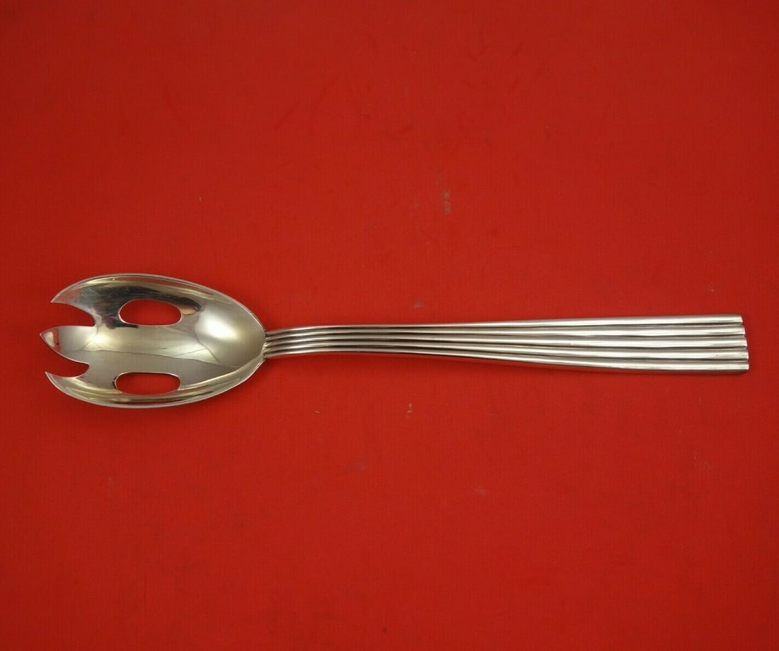 Buccellati Tiber Sterling Silver Salad Serving Fork 10 1/2 Italian: Buccellati Tiber Sterling Silver Salad Serving Fork 10 1/2 Italian A Buccellati Tiber salad serving fork in sterling silver, made in Italy. This heirloom piece is not monogrammed and is in excellent p