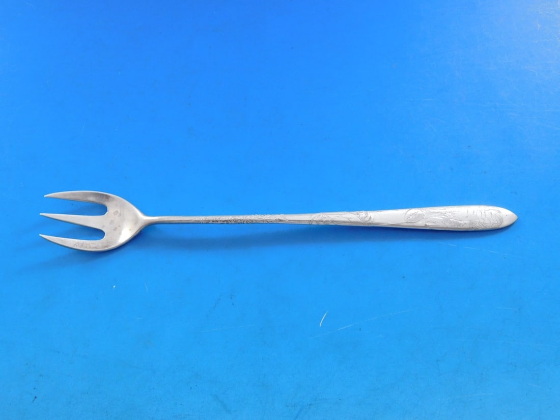 Sterling Silver Cocktail Fork Lap Over Edge Acid Etched Pattern by Tiffany: Sterling Silver Cocktail Fork Lap Over Edge Acid Etched Pattern by Tiffany This exquisite cocktail/oyster fork by Tiffany & Co. features the elegant Lap Over Edge Acid Etched pattern, crafted from hig