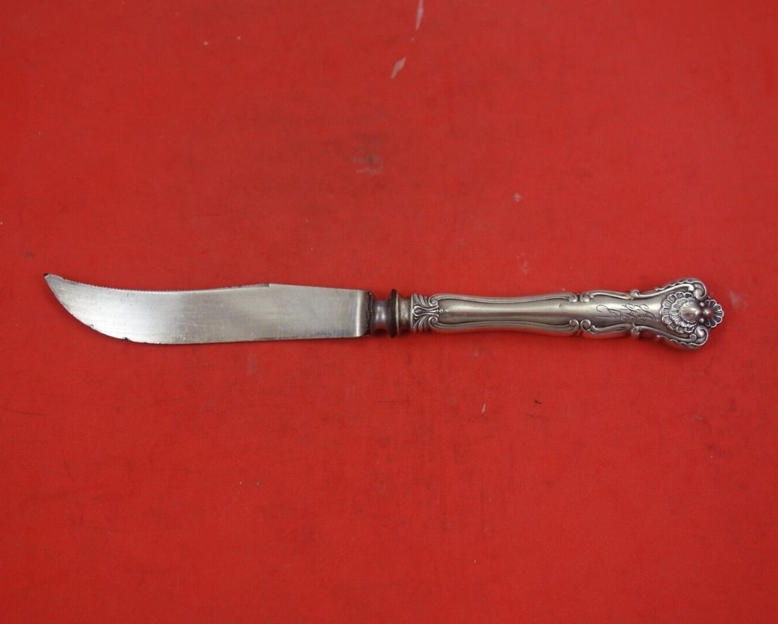 Durgin New Queens Sterling Silver Grapefruit Knife 6 3/4": Durgin New Queens Sterling Silver Grapefruit Knife 6 3/4" This exquisite grapefruit knife features a beautiful Sterling Silver hollow handle complemented by a silverplate blade, crafted by Durgin in t